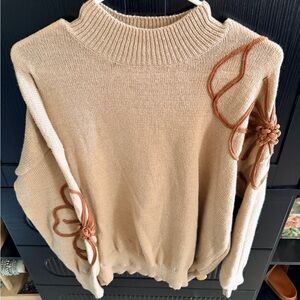 Elegant Tan Sweater with Floral Accents